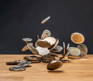 Close-up of coins on table