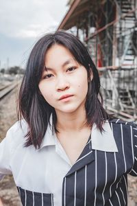 Portrait of beautiful woman standing outdoors