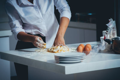 Midsection of person preparing food