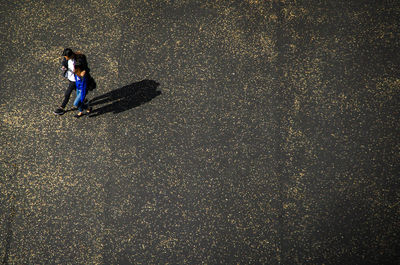 High angle view of woman standing on street