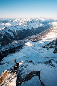 Aerial view of person on snowcapped mountain