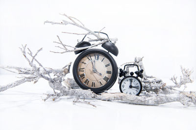 Close-up of clock on snow covered land