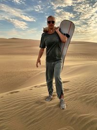 Full length portrait of man on desert