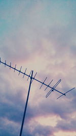 Low angle view of silhouette barbed wire against sky during sunset