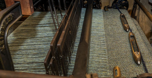 Close-up of old clothes hanging on wood