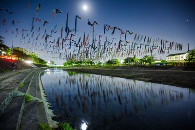 Reflection of sky in city at night