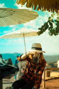 Portrait of woman photographing