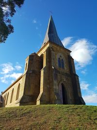 Low angle view of built structure against blue sky