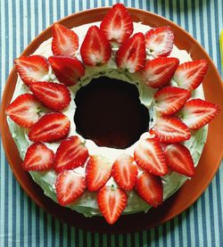 High angle view of strawberries in plate on table