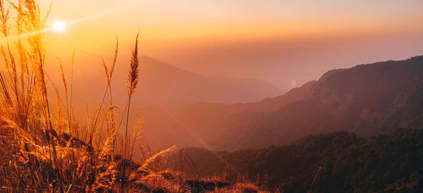 Scenic view of mountains against sky during sunset