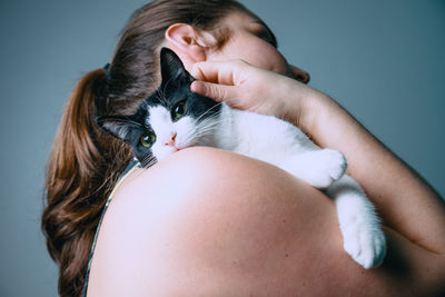 Midsection of woman with cat