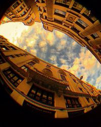 Low angle view of building against cloudy sky