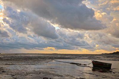 Scenic view of sea against cloudy sky