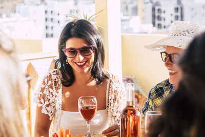 Smiling woman enjoying with friends in party