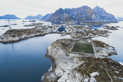 Soccer field on the cliffs of henningsvær by the sea