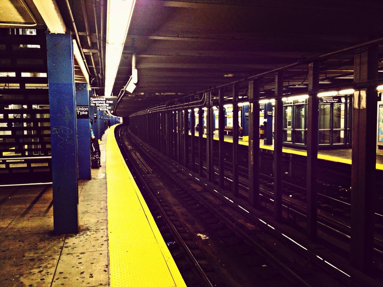 transportation, railroad track, railroad station platform, railroad station, rail transportation, public transportation, illuminated, the way forward, built structure, architecture, train - vehicle, travel, mode of transport, diminishing perspective, passenger train, architectural column, city, public transport, night, train