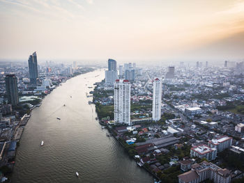 High angle view of city buildings against sky