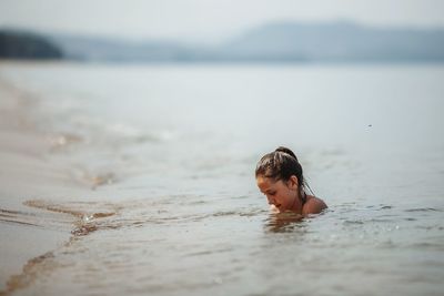 Portrait of boy in sea