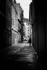 Rear view of man walking in city