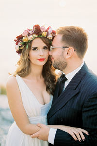 Portrait of bride holding bouquet