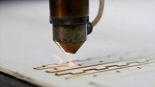 Close-up of laser cutting machine at factory