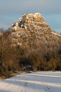 View of castle on mountain against sky