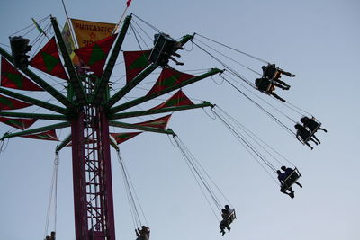 Low angle view of chain swing ride