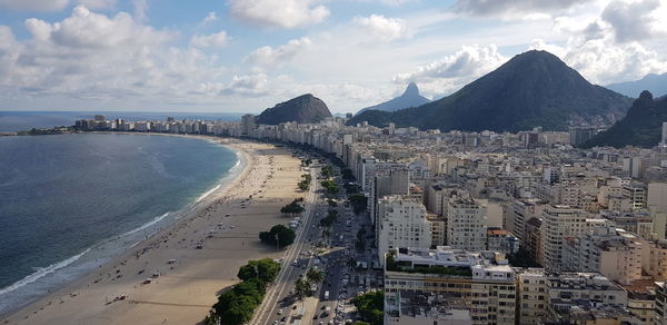 High angle view of sea and buildings against sky