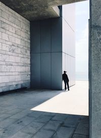 Man standing in corridor