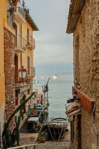 Scenic view of sea against buildings