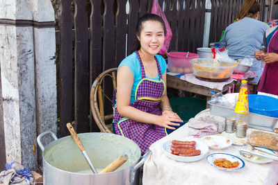 Portrait of a smiling girl holding food