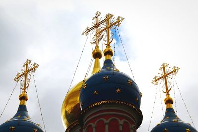 Low angle view of carousel against clear sky