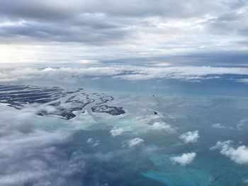 Aerial view of frozen landscape against sky