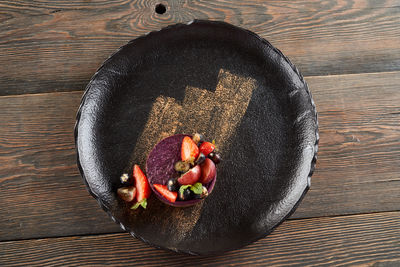 High angle view of fruits in bowl on table