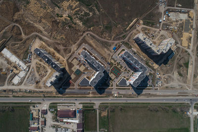 High angle view of buildings by road in city