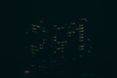 Illuminated buildings in city at night