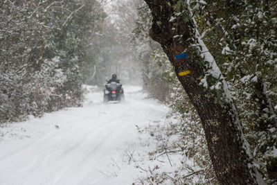 Snow on a way with a quad