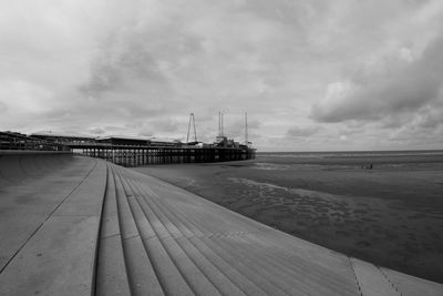 Pier over sea against sky