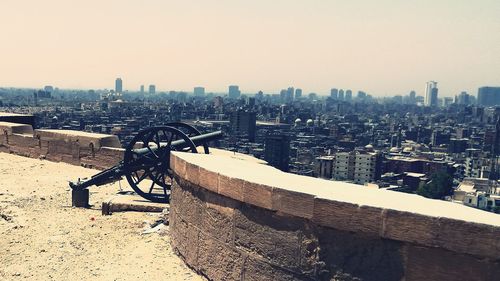 Panoramic shot of buildings in city against clear sky