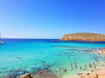 Scenic view of sea against blue sky