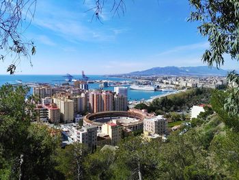 View of cityscape against blue sky