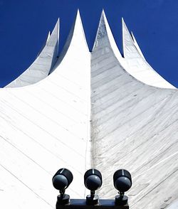 Low angle view of modern building against clear blue sky