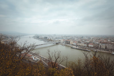 High angle view of bridge over river against cloudy sky