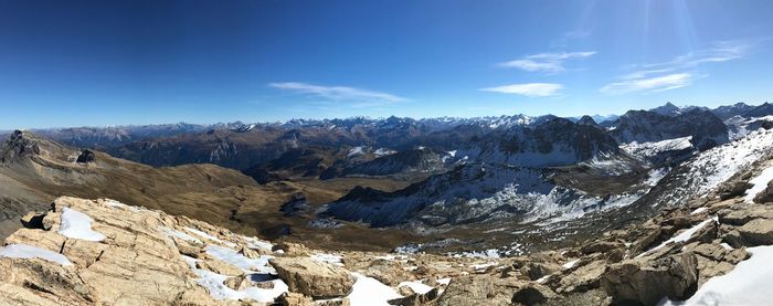 Scenic view of snowcapped mountains against sky