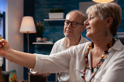 Man and woman sketching at home