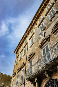 Low angle view of old building against sky