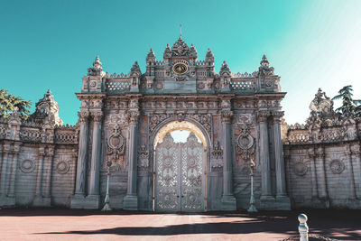 Facade of historic building against blue sky