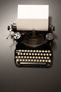 Close-up of old typewriter on table
