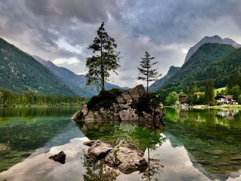 Scenic view of lake and mountains against sky