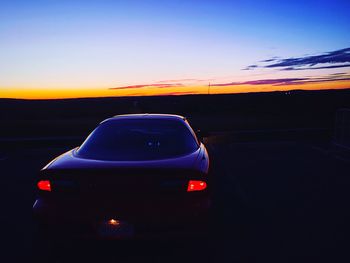 Close-up of car on road against sky